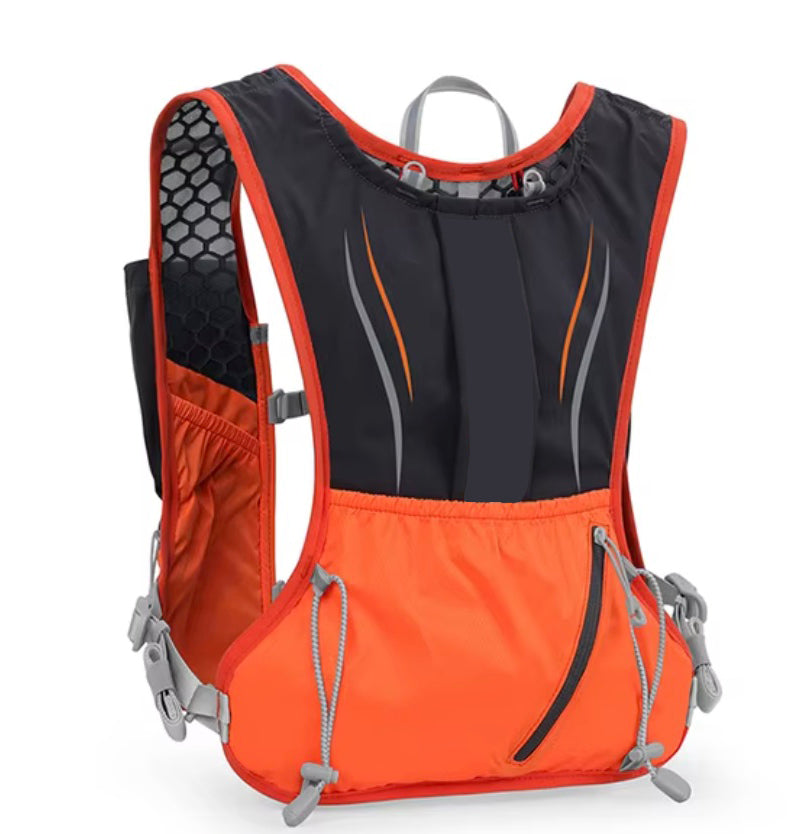 Orange and Black lightweight hydration vest for trail running with a 2L water bladder.